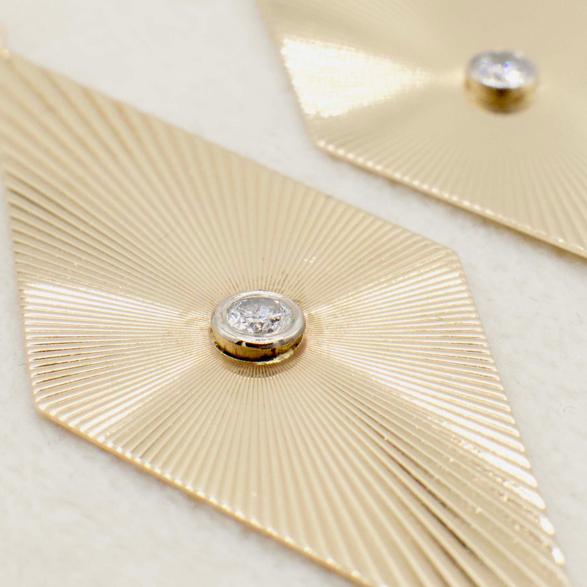 Circa 1970 14K Yellow Gold Fluted Ray Rhombus Earrings With Bezel Set Diamond Accents
